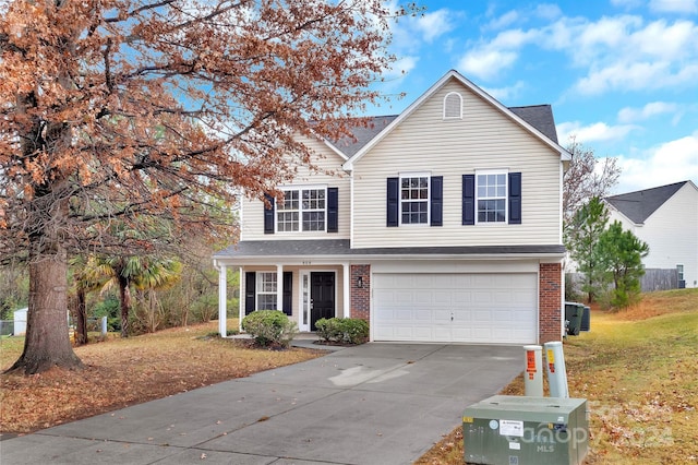 view of property with a front yard, a garage, and central air condition unit