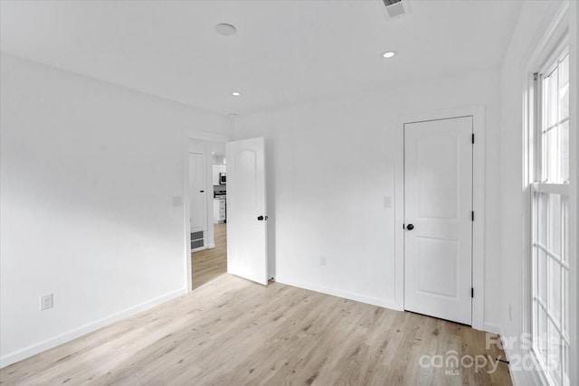 unfurnished bedroom featuring light hardwood / wood-style flooring