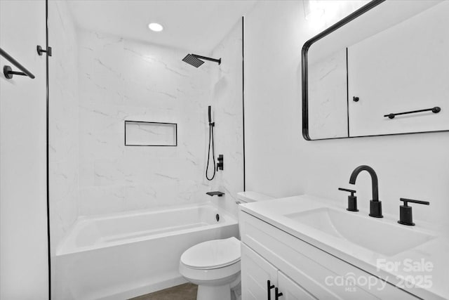 full bathroom featuring vanity, toilet, and tiled shower / bath