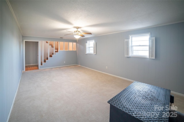 interior space featuring crown molding and ceiling fan