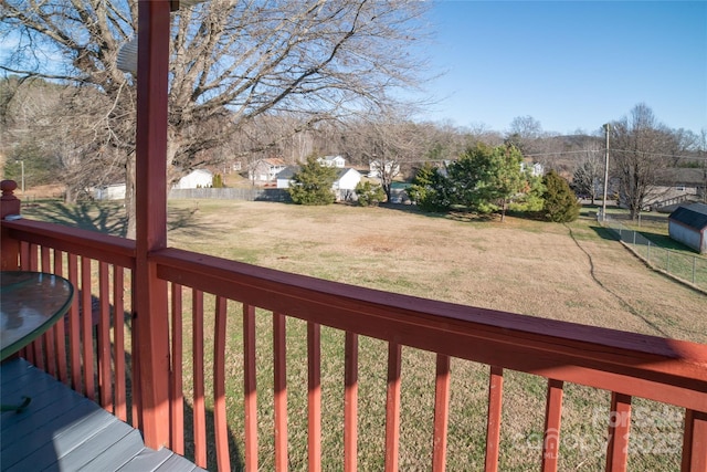 wooden terrace with a yard