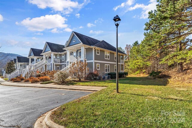 view of front of house featuring a front lawn and a porch