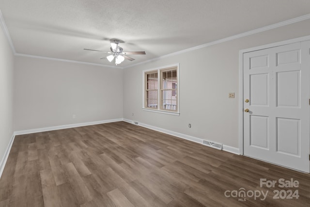 spare room featuring hardwood / wood-style floors, ceiling fan, ornamental molding, and a textured ceiling