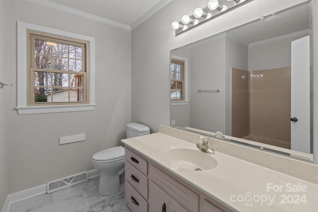 bathroom featuring a shower, crown molding, vanity, and toilet