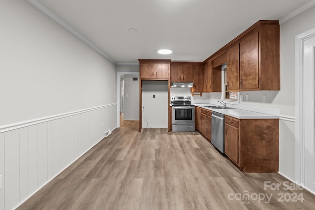 kitchen with stainless steel appliances, crown molding, light hardwood / wood-style floors, and sink