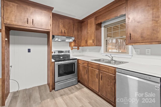 kitchen featuring sink, light wood-type flooring, and stainless steel appliances