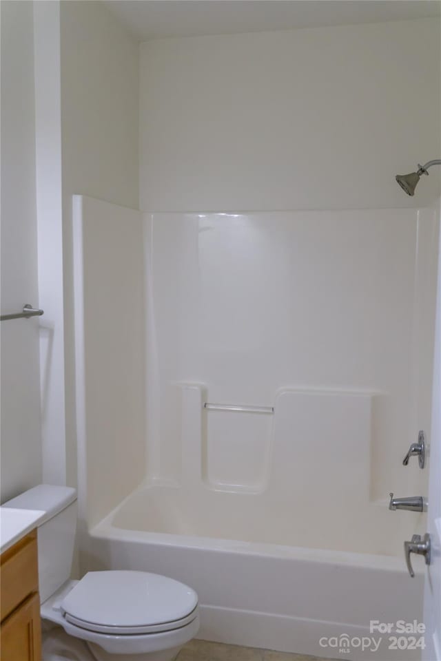 full bathroom featuring vanity, toilet, and bathing tub / shower combination