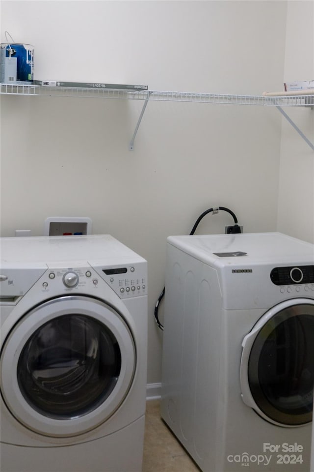 washroom featuring washing machine and dryer