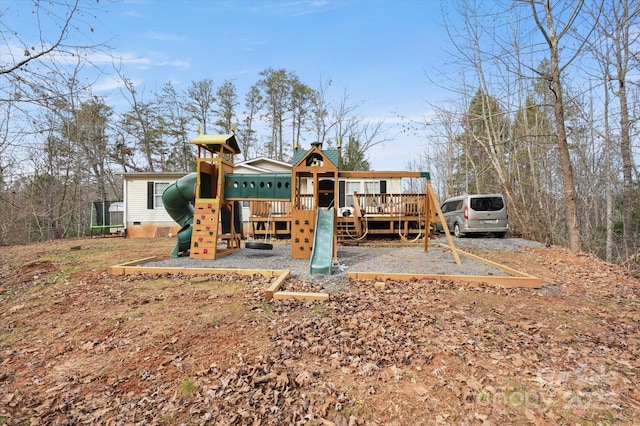 back of house with a playground