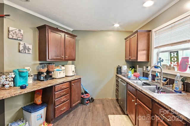 kitchen featuring stainless steel dishwasher, ornamental molding, sink, and light hardwood / wood-style flooring