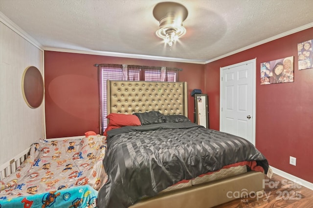 bedroom with a textured ceiling, ceiling fan, and ornamental molding