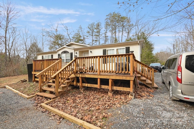 view of front of home featuring a wooden deck