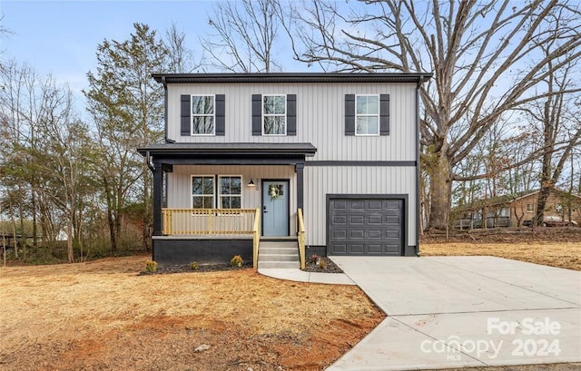 front facade with a porch and a garage