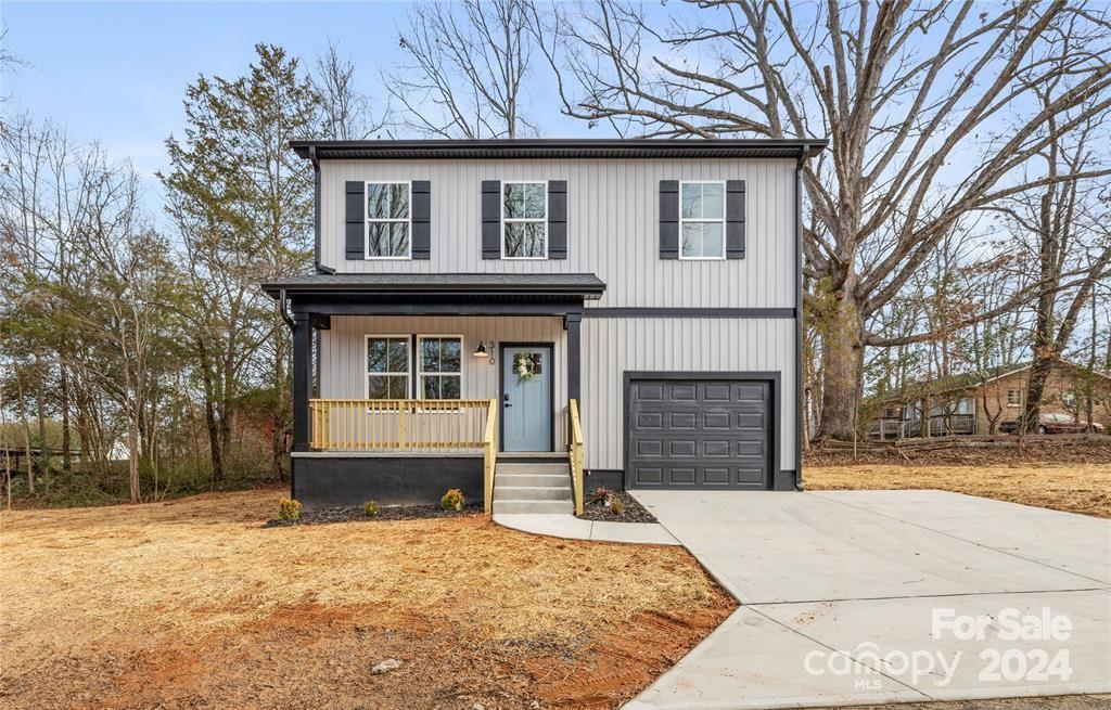 310 Town St, Landis, NC 28088 - front facade with a porch and a garage