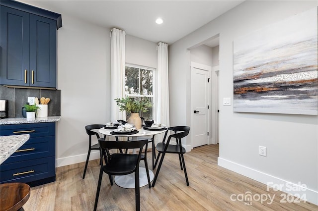 dining room featuring light hardwood / wood-style flooring