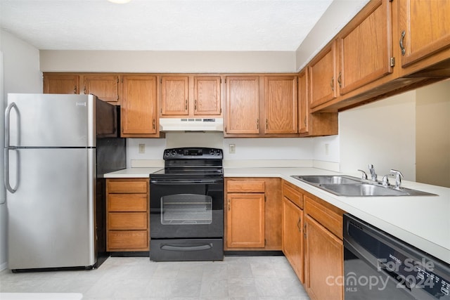 kitchen featuring sink and black appliances