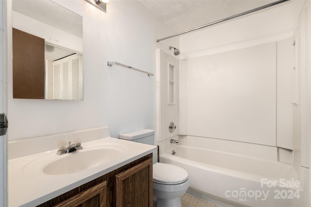 full bathroom featuring tile patterned flooring, a textured ceiling, toilet, vanity, and shower / bathtub combination