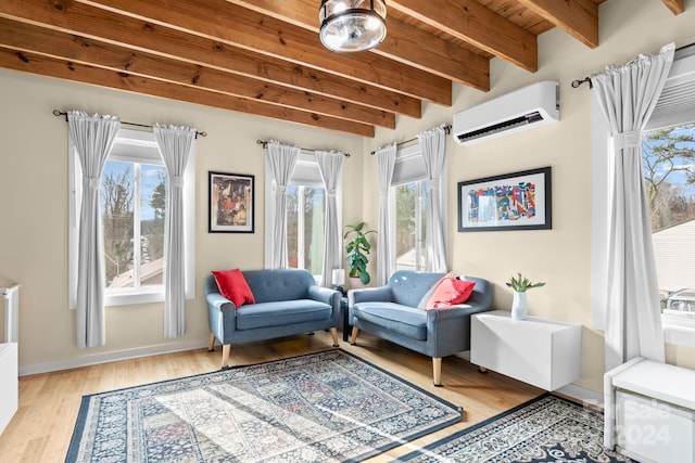 living area with a wall mounted air conditioner, light wood-type flooring, wooden ceiling, and beamed ceiling