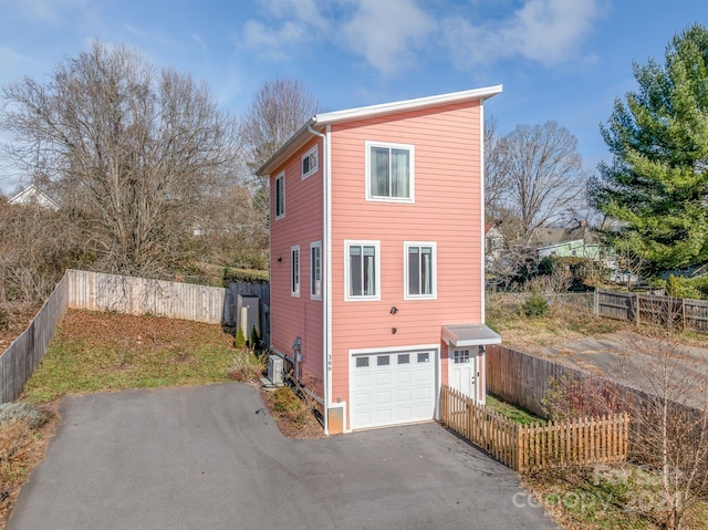 view of property exterior with a garage