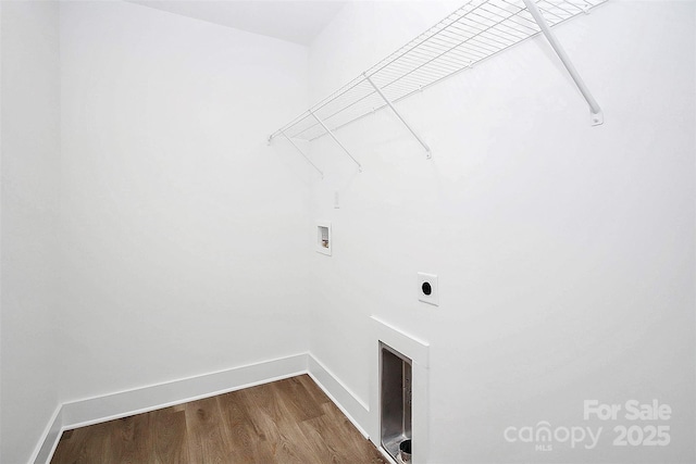 clothes washing area featuring washer hookup, wood-type flooring, and hookup for an electric dryer