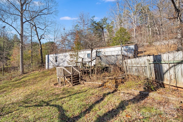 view of yard with a wooden deck