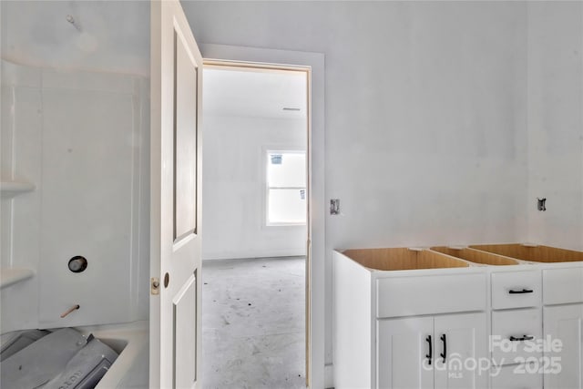 full bathroom with concrete floors