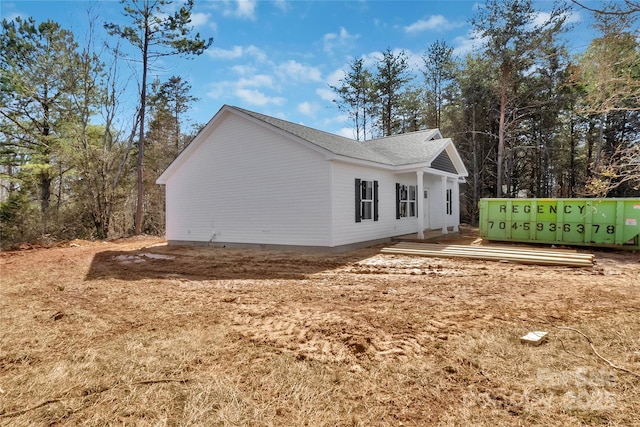 view of property exterior featuring a wooden deck