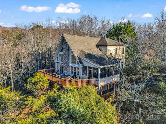 rear view of property with a deck