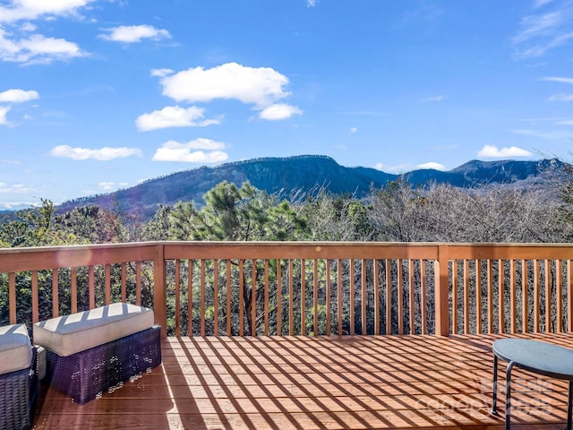 wooden deck featuring a mountain view