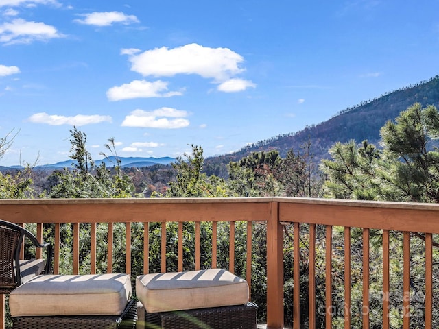 wooden deck with a mountain view