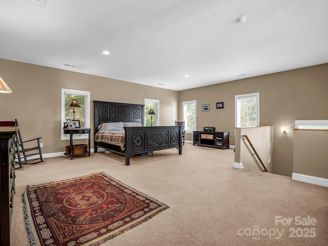 bedroom with light colored carpet