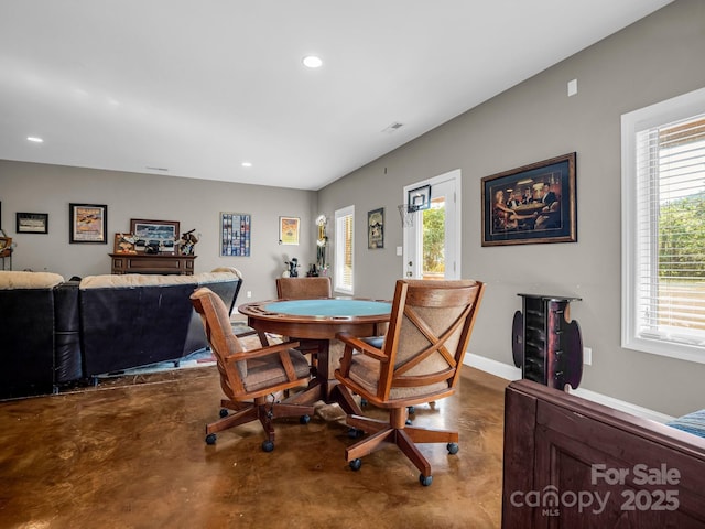 dining area featuring concrete floors