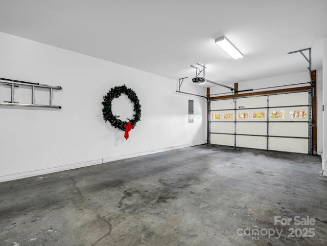 garage featuring electric panel and a garage door opener