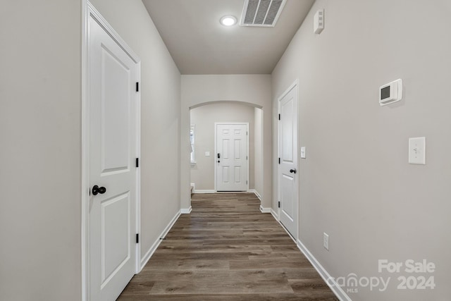 corridor with dark wood-type flooring