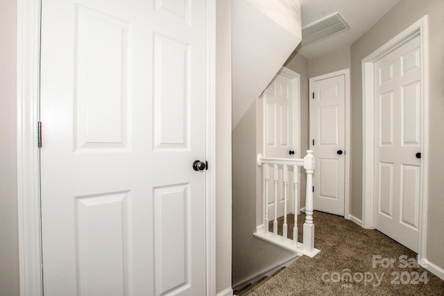 corridor with carpet floors