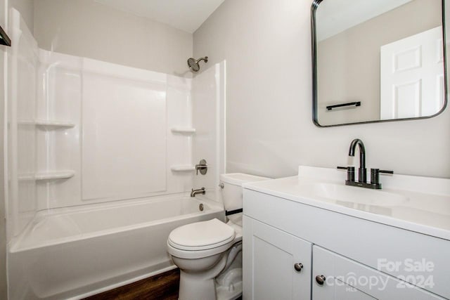 full bathroom featuring vanity, hardwood / wood-style floors,  shower combination, and toilet