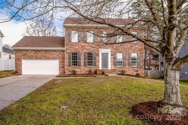 colonial inspired home with a garage and a front lawn