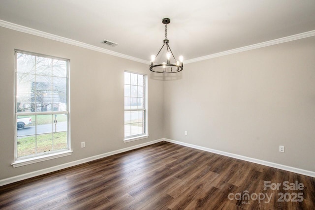 unfurnished room with ornamental molding, plenty of natural light, a notable chandelier, and dark hardwood / wood-style flooring