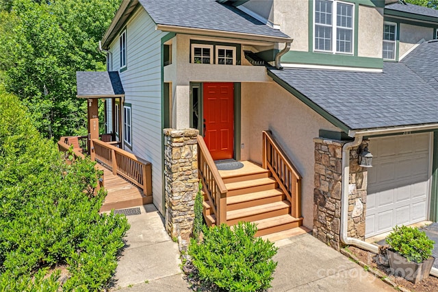 doorway to property with a garage