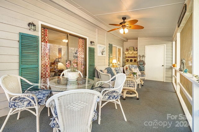 sunroom / solarium featuring vaulted ceiling and ceiling fan