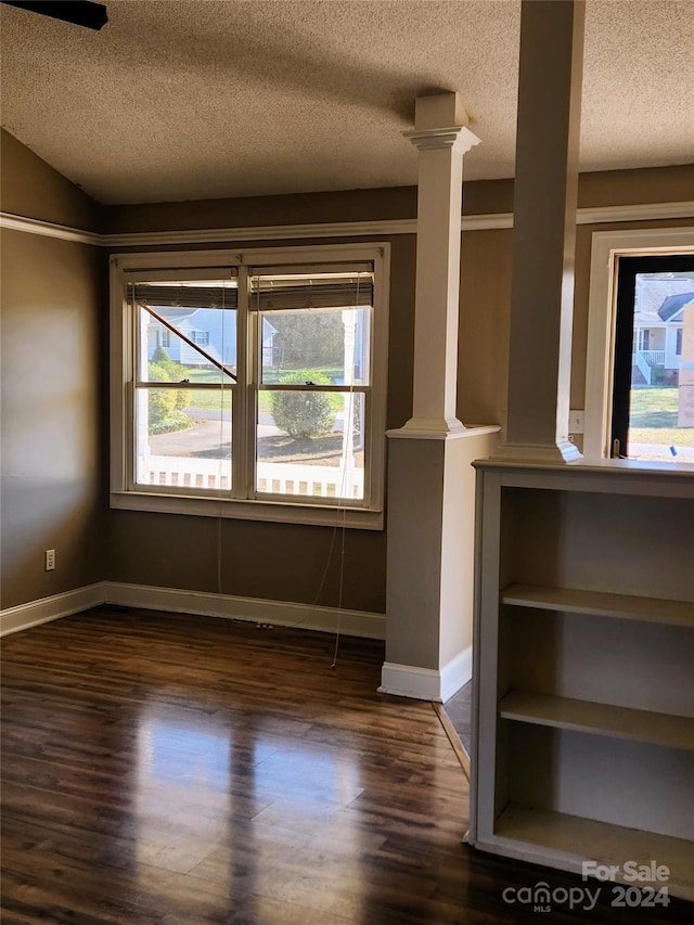 interior space featuring dark hardwood / wood-style floors and a textured ceiling