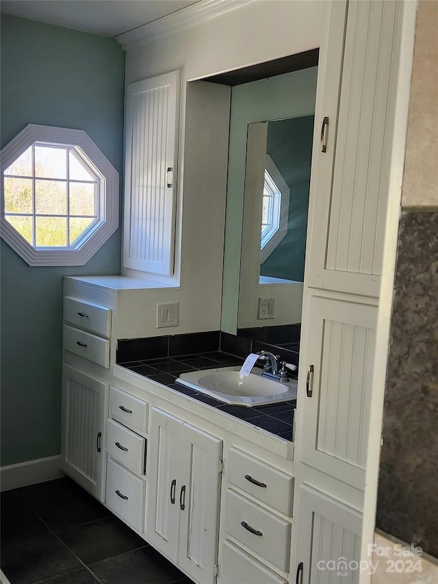 bathroom with tile patterned floors and vanity