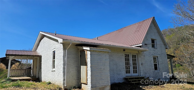 view of side of home featuring french doors