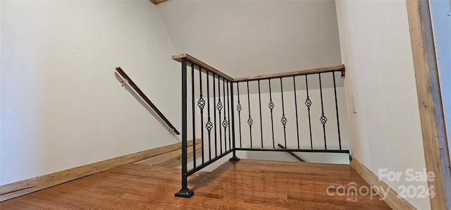 stairs with wood-type flooring