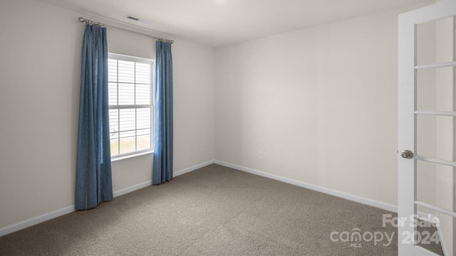 empty room with carpet flooring