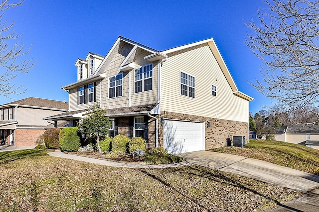 view of side of home with a garage, central air condition unit, and a lawn