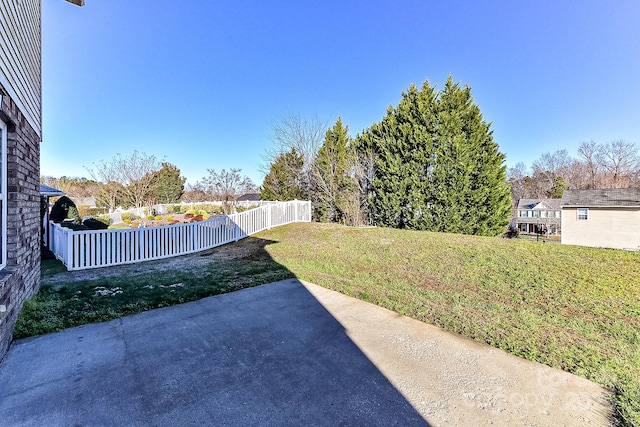 view of yard with a patio and an outbuilding