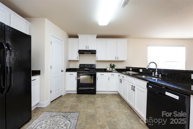 kitchen featuring white cabinetry, sink, and black appliances