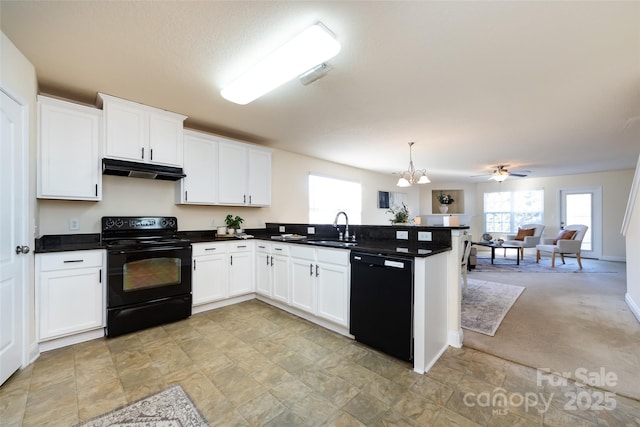 kitchen with sink, black appliances, kitchen peninsula, pendant lighting, and white cabinets