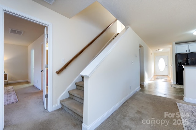 stairway with carpet flooring